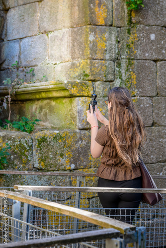 Tourist Filming the Stone Walls of Pambre Castle