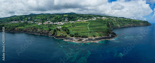 Aerial drone view of the natural volcanic pools of Santo Antonio on the rugged north coast of Sao Miguel, Azores, Portugal
