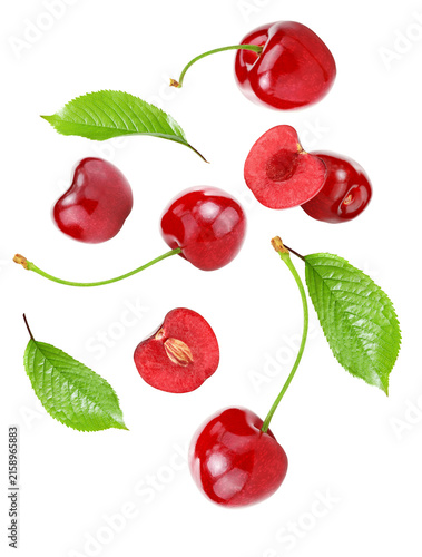 flying red cherry fruits isolated on white background. clipping path