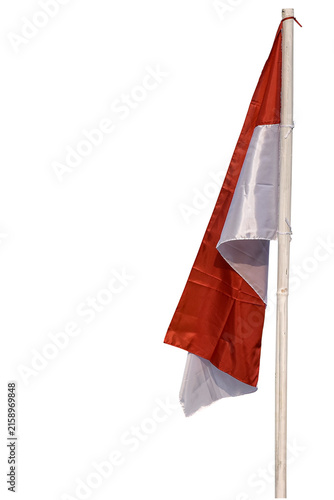 The Indonesian Red and White flag on a bamboo pole, Indonesian national flag waving against a white background.