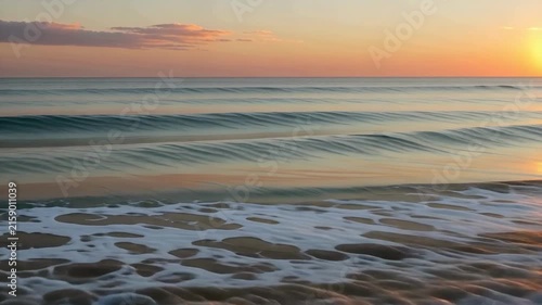 Ocean Wave Rolling and Crashing on Sandy Beach at Sunset