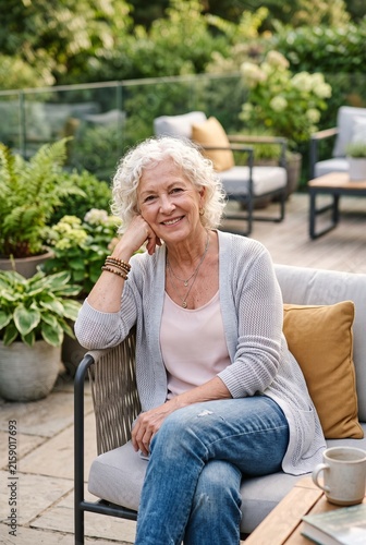 Happy senior woman relaxing in a beautiful garden