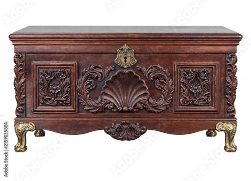 Elegant antique wooden cabinet with ornate carvings and gold accents