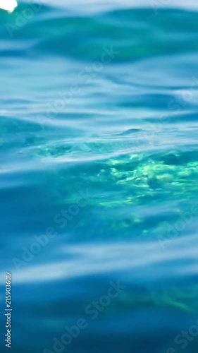 Clear blue water surface with gentle waves