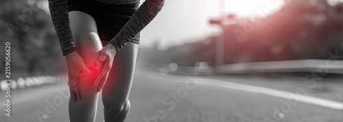 Runner Suffers Knee Pain on Road with Red Highlight Indicating Injury