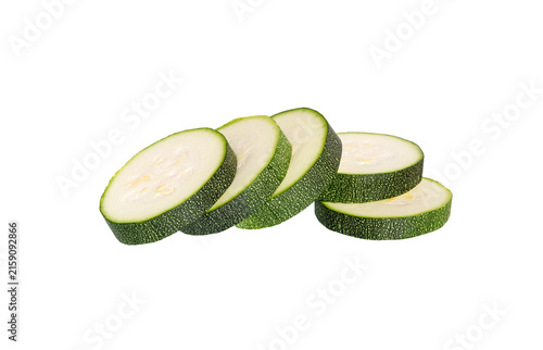 Chopped zucchini isolated on white. Courgette slices.