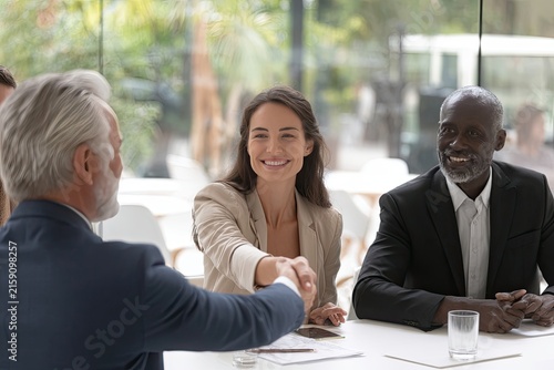 Diverse Business Team Shaking Hands Celebrating Partnership Success