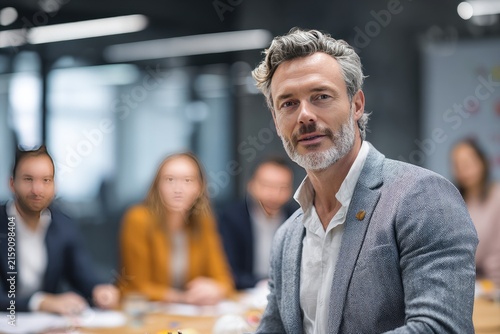 Professional Team Meeting Leadership Presentation in Modern Office