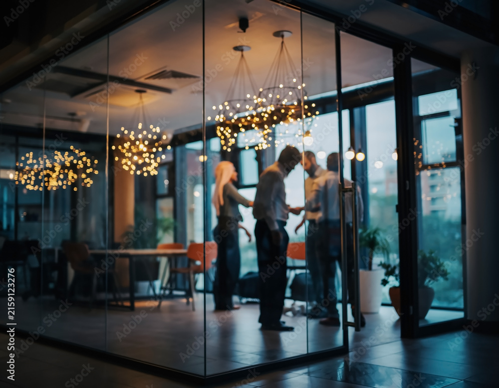 Fototapeta premium Defocused evening office celebration with blurred professionals socializing after work.Premium corporate background for business networking,employee engagement,company culture,events,holiday marketing