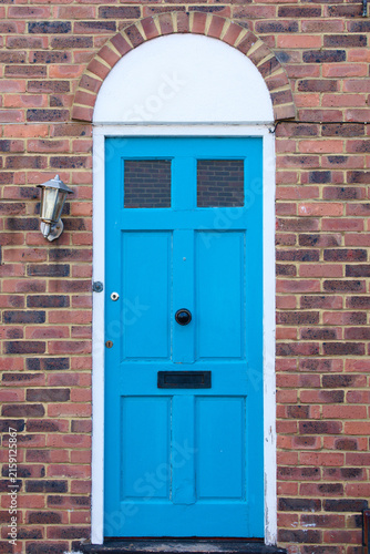 Принти на полотні Blue door and a brick wall.