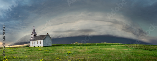 Old, abandoned church out on the great plains in a storm