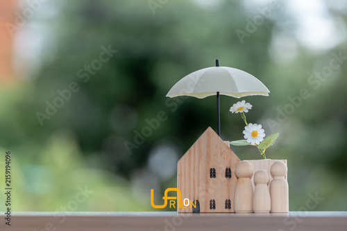 Принти на полотні Home insurance concept with family and house protected by glowing umbrella, symbolizing property protection, financial security, safety, coverage, insurance