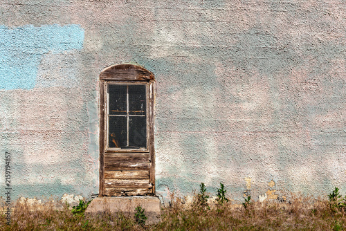 Old wooden door on side of building