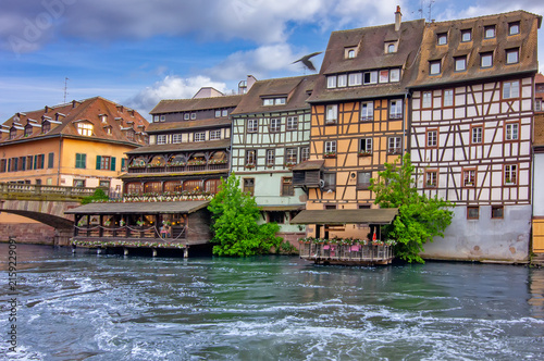 Scenic view of Saint Martin Bridge spanning the Ill River in the historic Petite France district of Strasbourg, France.