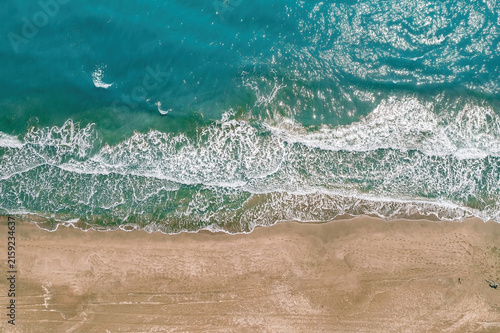 Patara, Kas. Top down aerial view of turquoise waves crashing on the sandy coastline of Patara beach.  Antalya, Turkey.