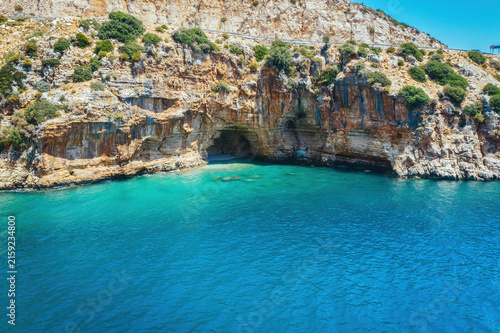 Amazing turquoise beach and cove on the way to Demre - Finike. Detail of cave. Kas, Antalya, Turkey.
