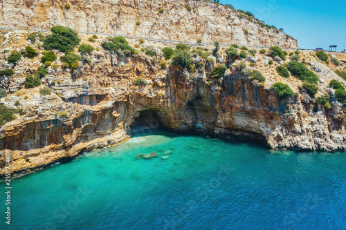 Amazing turquoise beach and cove on the way to Demre - Finike. Detail of cave. Kas, Antalya, Turkey.