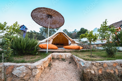 Large tent in a camping area, set up for accommodation in a spacious outdoor setting.