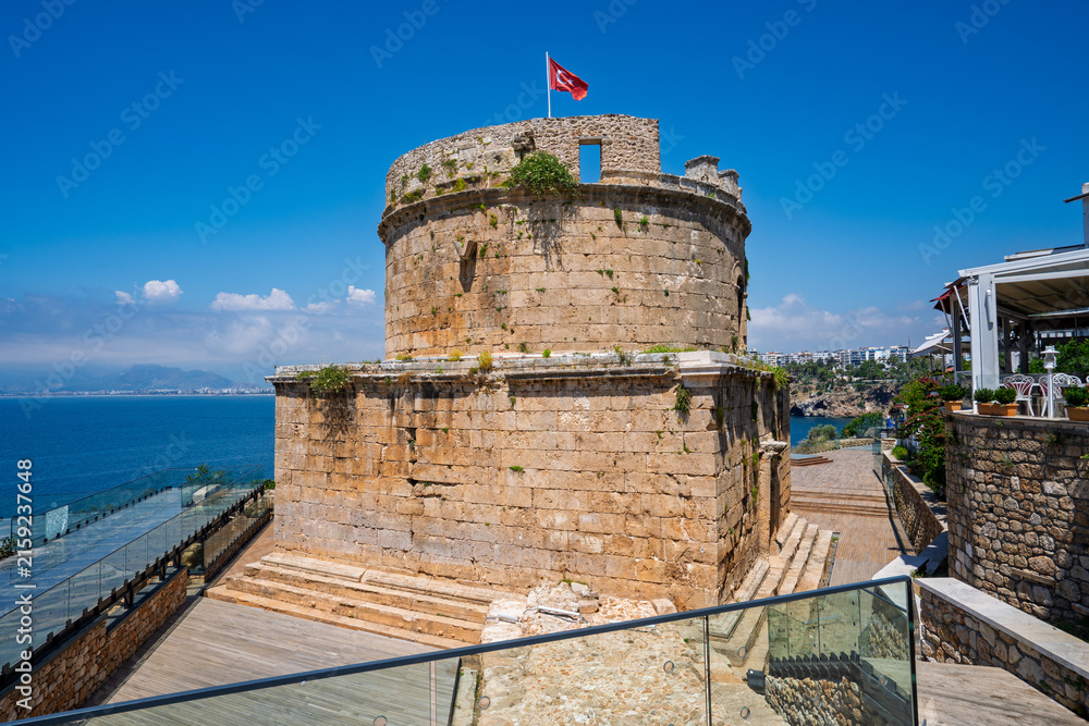Fototapeta premium Hidirlik Tower with the Mediterranean Sea and coastal promenade in old town Antalya, Turkey.