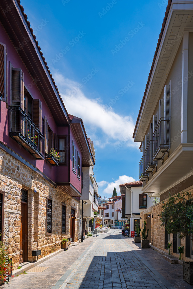 Fototapeta premium Narrow shaded lane between traditional buildings in Kaleici Old Town, Antalya, Turkey.