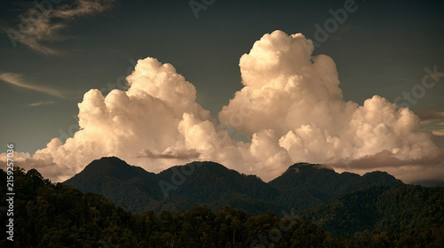 Mountain landscape in sunlight with clouds