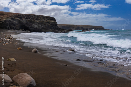 Rock formations and caves on the Atlantic Ocean coast in Ajuy, Fuerteventura, wallpaper or background for your project