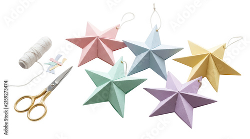 Handmade paper star ornaments in pastel colors isolated on transparent background