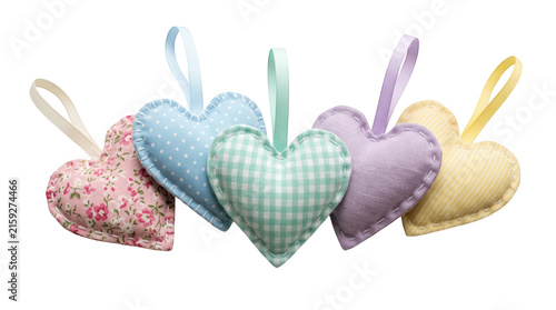 Five colorful fabric hearts with ribbons isolated on transparent background