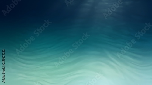 Abstract underwater background featuring deep blue and teal ocean ripples with soft light rays penetrating the surface for serene designs.