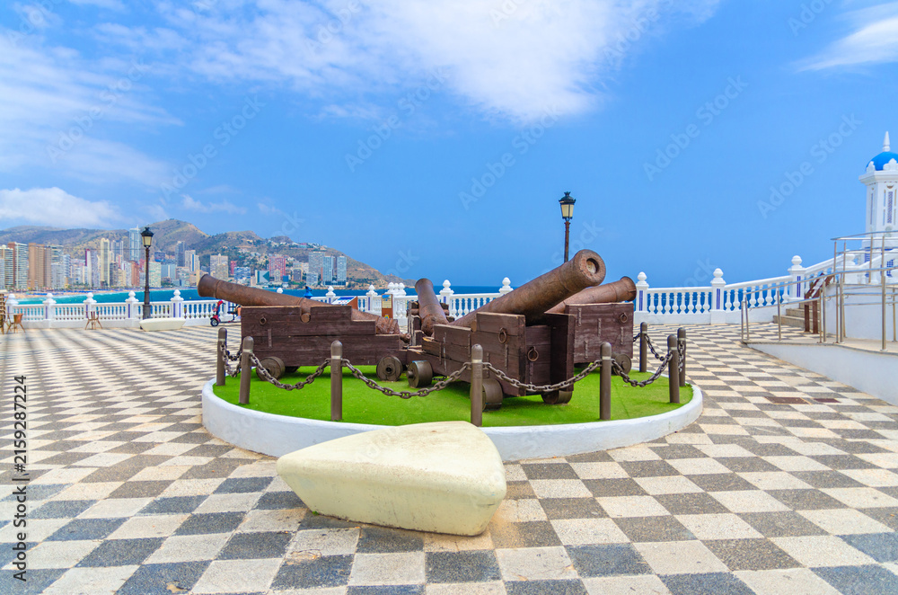 Fototapeta premium Cannons monument on Placa de Santa Anna square Mediterranean Balcony El Castell Old town Benidorm city historic centre in summer day, Valencian Community, Spain