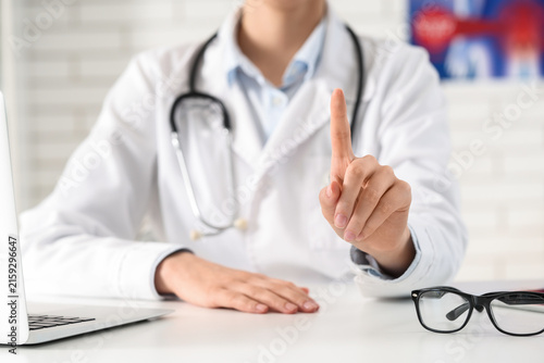 Doctor in white coat with s...