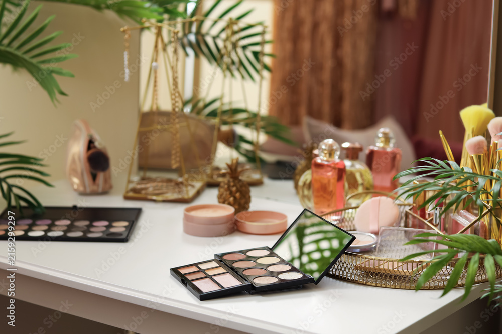 Fototapeta premium Makeup products on table in dressing room, closeup