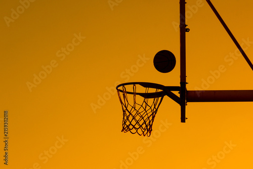 Silhouette Basketball Hoop and Ball Score at Sunset
