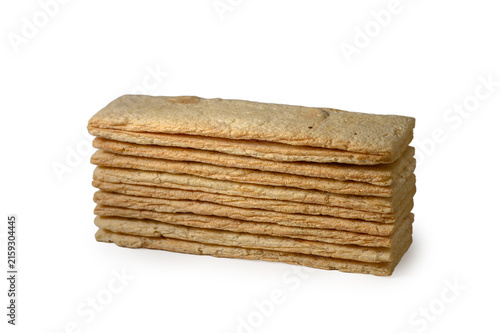 фотографія Tall stack of rectangular crispy wheat crispbread sticks on a white background