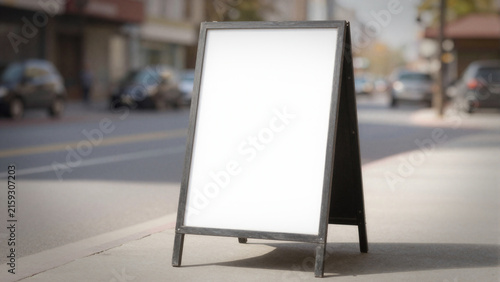 Blank white sidewalk a-frame sign mockup on a city street, outdoor store advertisement board.