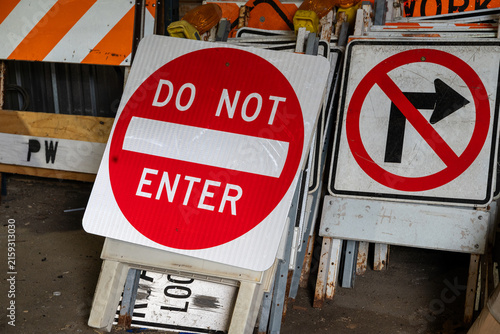 Fotografie Close up view of stored traffic signs including a Do Not Enter sign in a public