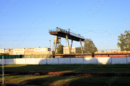 Bild auf Leinwand Industrial gantry crane with metal rails for loading and unloading railway cars