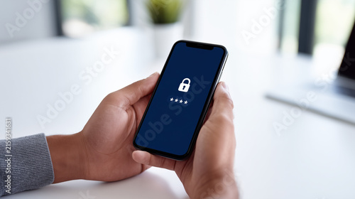 Person holding a smartphone with a password and lock icon on screen, ideal for cybersecurity, secure login, and digital privacy concepts