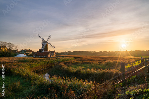 Cley Windmill at sunset in the village of Cley, Norfolk, UK