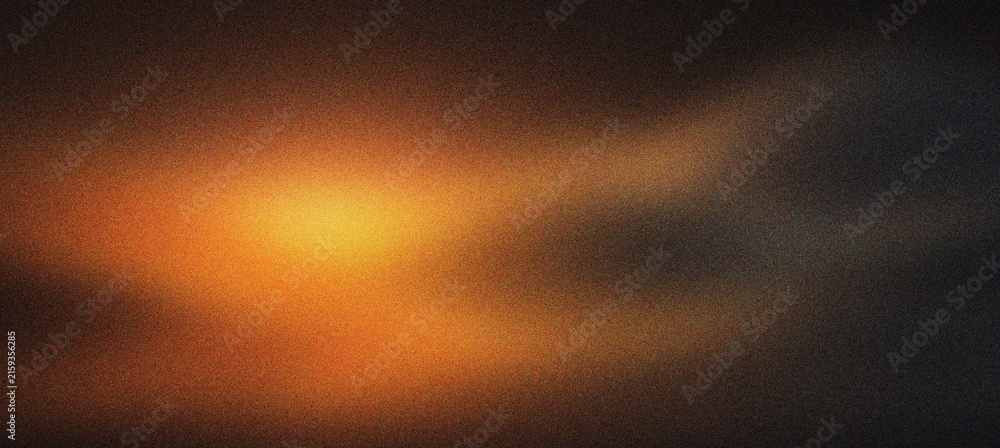 Naklejka premium Cinematic lens flare with warm orange light leak on dark background. Abstract glowing light effect for film overlay. Moody amber light texture for creative video editing and photo overlays.