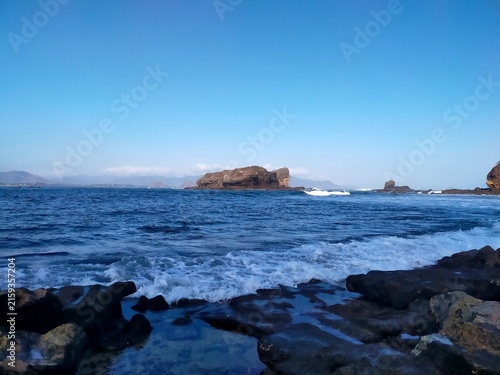 Stunning Seaside View with Distant Rocky Islands
