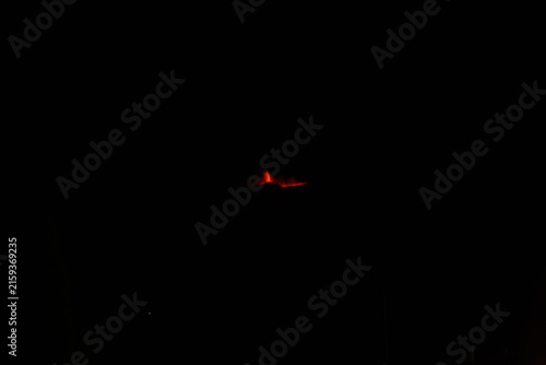 Mt. Etna volcano erupting at night in Sicily Italy