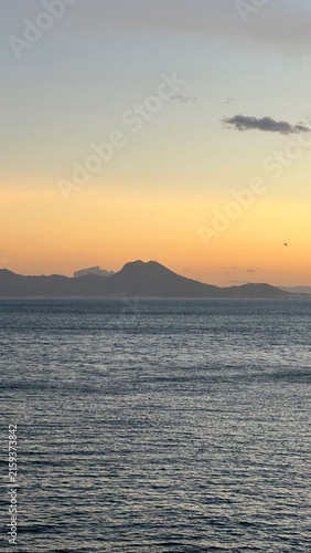 sunset over the sea
Mount Athos in Greece at sunset a bright sunrise in the early summer morning. Beautiful silhouette of Mount Athos in Greece in the Aegean Sea. Calm seawater surface. Orange disk of