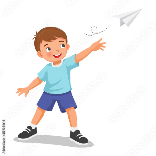 Little boy holding playing with a paper airplane