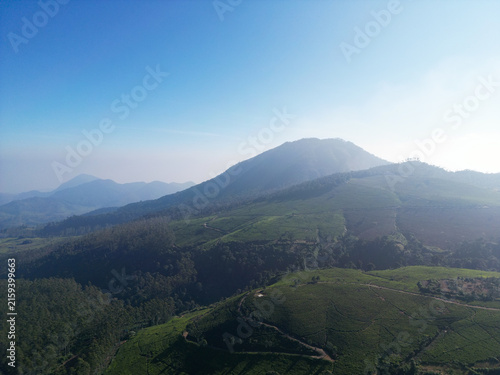 Aerial View of Hazy Volcano Above Highland Tea Plantations