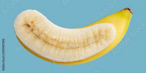 A peeled banana with its yellow peel folded back reveals the pale curved fruit against a solid blue background.