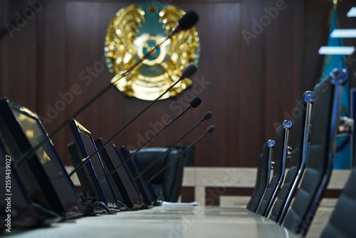 фотографія Microphones with communicators on the table