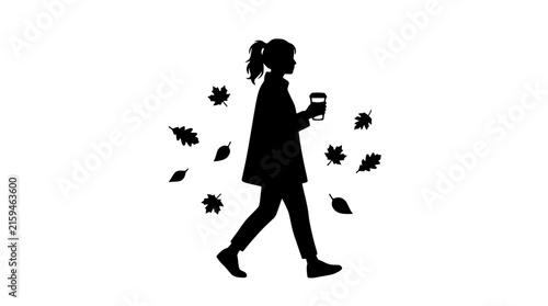 Silhouette of a woman walking with a coffee cup in autumn