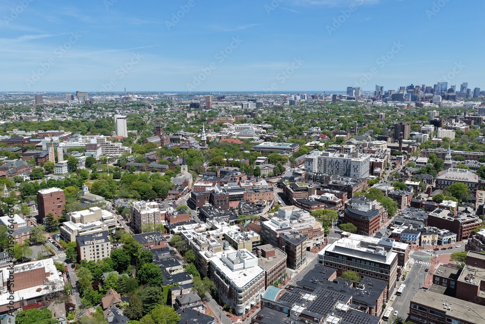 Fototapeta premium Aerial view of Cambridge and Harvard University with historic churches and Boston skyline, Massachusetts, USA. g.