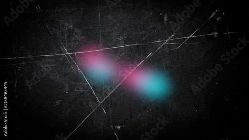 Abstract dark textured background with glowing pink and blue light particles